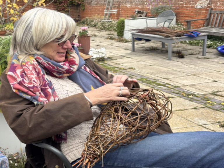Lady making willow pheasant